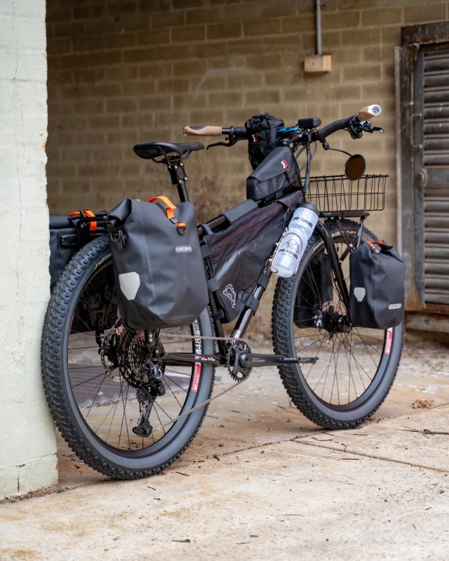 Mick got in touch with us for an expedition ready bike to tackle overlanding Australia via several of the quintessential bikepacking routes 🗺️

We landed upon the @surlybikes Bridge Club with a full custom spec to handle the rigours of long haul solo bikepacking.

With long trips, comfort is key, so special attention was paid to contact points and position.

Surly Bridge Club, Medium
Cane Creek 40 headset
Cane Creek eeSilk suspension stem
Velo Orange Crazy Handlebar
Ergon GP1 Evo Biokork grips
Cane Creek eeSilk suspension seatpost
Ergon SM Comp saddle
Burgtec Mk4 Pedals
Shimano CUES 11speed groupset
Old Man Mountain Elkhart front rack
Wald 137 Basket
Ortlieb Fork Packs
Old Man Mountain Divide rear rack
Ortlieb Gravel Panniers
Revelate Ranger Framebag, large
Botched Bikes Dragonfly double bottle adapter
King Cage Iris bottle cages
Off Course Zefal Magnum bidons
Schmidt SON 28 Dynamo front hub
DT Swiss 350 rear hub
DT Swiss XM481 27.5” Rims
DT Swiss Competition Spokes
Vittoria Mezcal Trail tyres 27.5 x 2.6”
kLite MTB Ultra front dynamo light
kLite Micro USB Charger
Revelate Magtank
Revelate Mountain Feedbag
Quadlock Stem Cap Mount
B+M Cyclestar Mirror

Thanks, Mick!
Happy Trails✌️

@surlybikes 
@surlyoz 
@canecreekusa 
@velo_orange 
@ergonbike 
@burgtec 
@rideshimano 
@shimanoaustralia 
@oldmanmountainracks 
@ortlieb_waterproof 
@revelatedesigns 
@botched.bikes 
@ron_kingcage 
@dtswiss 
@dtswiss_distributor_aus 
@vittoriatires 
@vittoria_australia 
@klite_dynamo_power 
@quadlockcycle 
@buschundmueller 

#surlybikes #surlybridgeclub #offcoursecustoms
