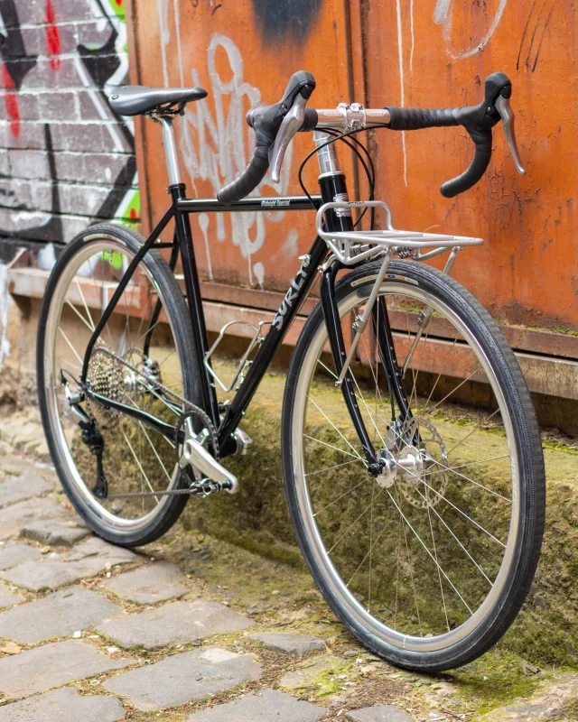 Check out Rachael’s custom @surlybikes Midnight Special build! 👀

Black was sold out in the required size so we had one powder coated and added some silver grey decals. 🖤

Quick, comfortable and capable. So good! ✨

Surly Midnight Special 50cm
Cane Creek Hellbender 70 headset
Ritchey Classic 220 stem
Ritchey Classic Butano handlebar
Ergon All-Road bar tape
Ritchey Classic two bolt seat post
Brooks Cambium C17 saddle
Ritchey Zeta Wheelset
Panaracer Gravelking SS 700 x 40mm tyres
Shimano CUES 1x10 silver groupset
Shimano M540 pedals
Surly 8-Pack Rack
Bluelug Select 3 Cage

Thanks, Rachael!
Happy trails✌️

@surlybikes 
@surlyoz 
@canecreekusa 
@ritcheylogic 
@ergonbike 
@ritcheylogic 
@brooksengland 
@panaracer_world 
@shimanoaustralia 
@bluelug 

#surlybikes #surlymidnightspecial  #offcoursecustoms